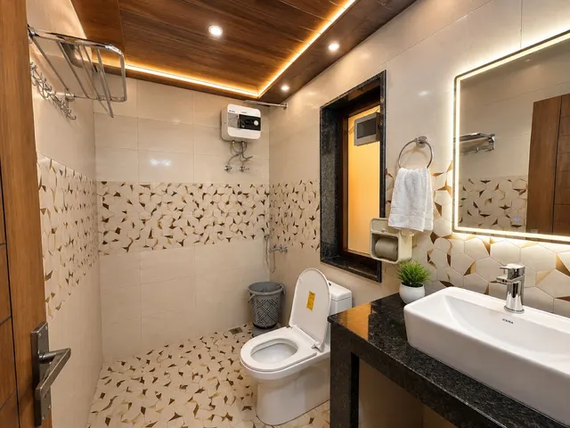 Private bathroom with a lit mirror