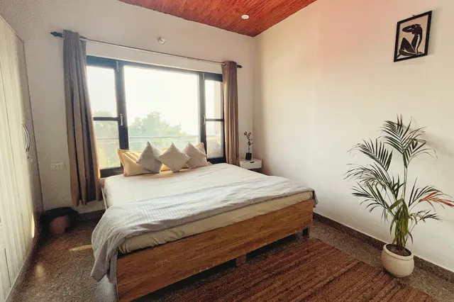 Third bedroom with a queen bed and a wooden ceiling