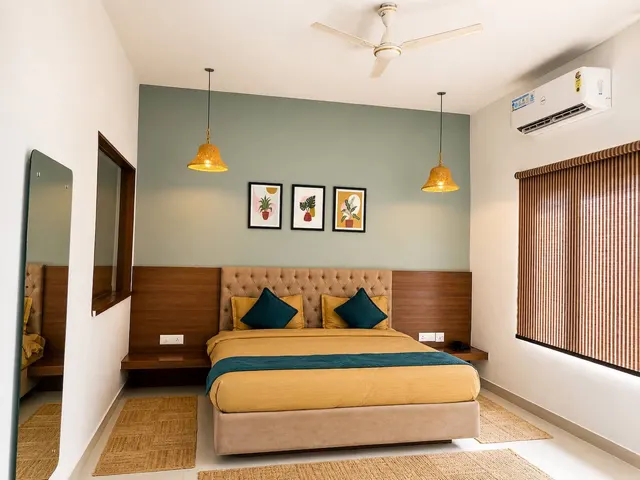 Air-conditioned king room with wooden headboard